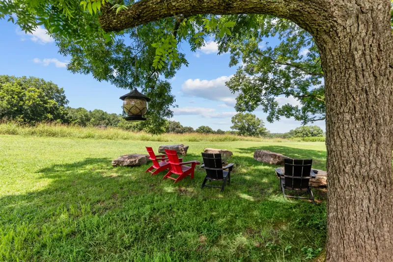 Open country grounds with mature trees on the property